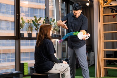 chiropractor holding spine